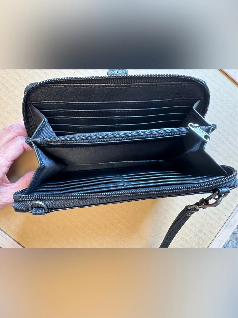 The Sak Black Leather Wristlet Clutch with Snap Strap